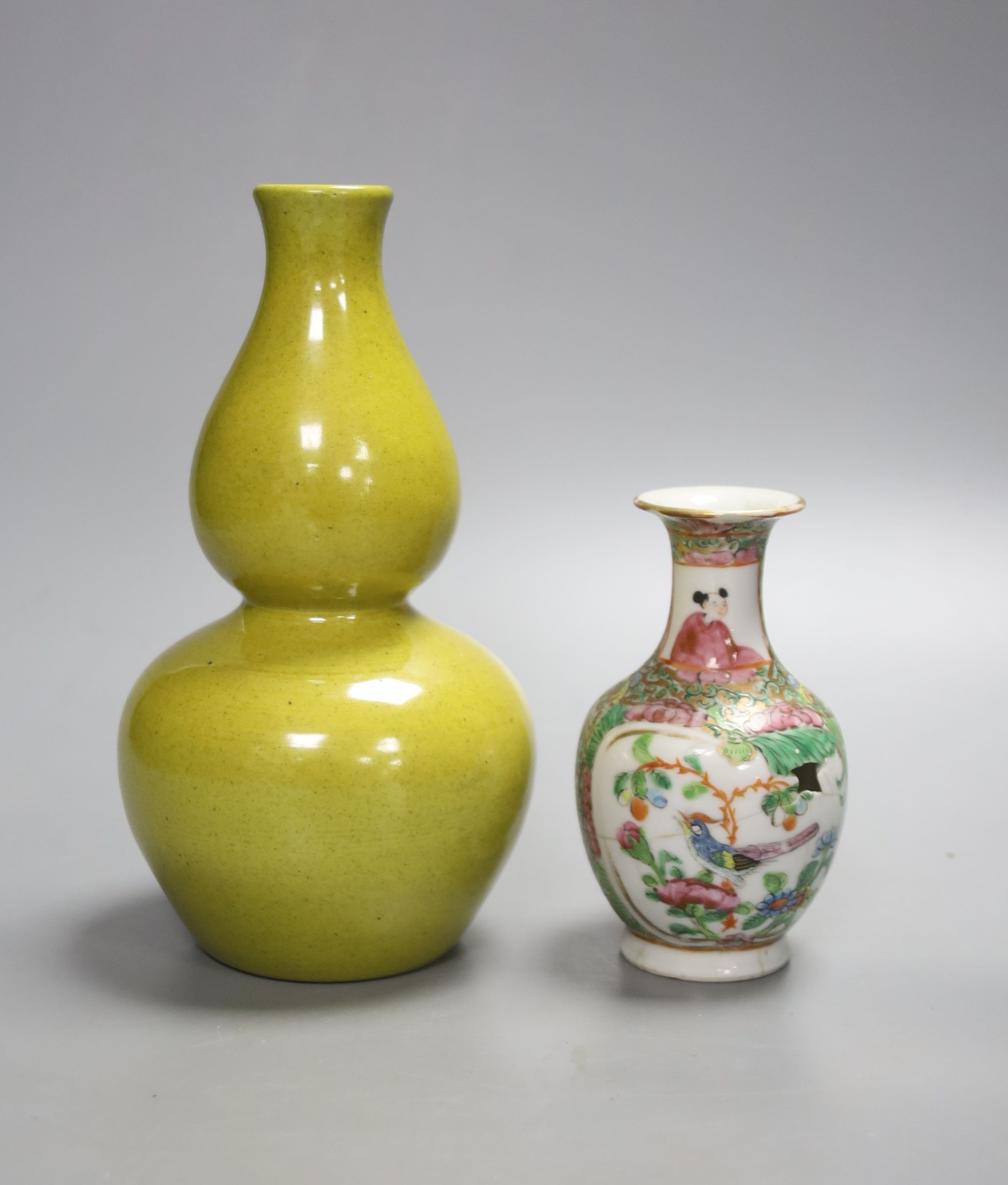 A Chinese yellow ground double gourd vase and a similar famille rose baluster vase, tallest 18cm